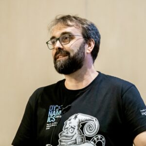 A photo of a man in a black shirt